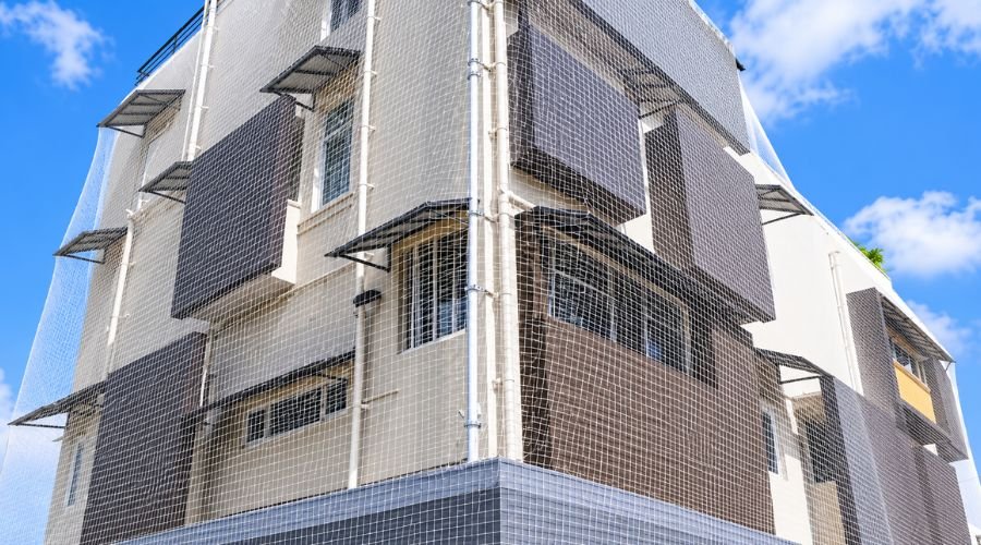 Complete building covered with high-quality pigeon nets by Hasini Safety Nets in Chennai