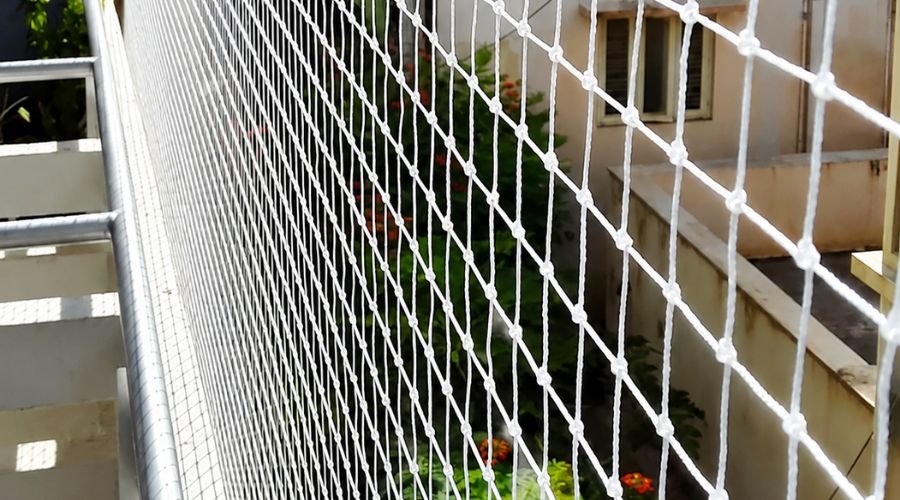 Pigeon-free clean balcony protected with high-quality nets by Hasini Safety Nets in Chennai